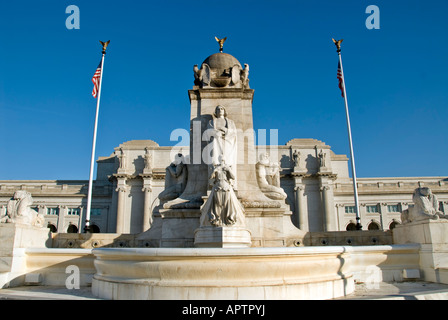 WASHINGTON DC, USA - The Columbus Fountain, located in the plaza outside the main entrance to Union Station in Washington DC, was erected in 1912. At its center is a 45-foot shaft depicting the prow of a ship. A 15-foot high statue of Christopher Columbus gazes south towards the U.S. Capitol Building. A winged figurehead depicts Discovery, and other statues represent the Old and New Worlds. The fountain is constructed from marble, its sculptor was Lorado Z. Taft, and the architect Daniel H. Burnham. Stock Photo