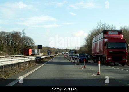 M4 Motorway Roadworks Coned Carriageway Oncoming Traffic 50 mph speed limit on a shared carriageway Stock Photo