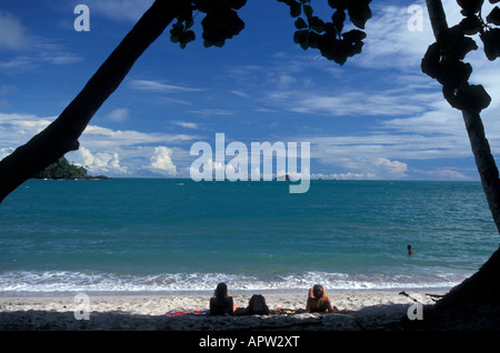 Sunbathers on the beach, Manuel Antonio National Park ...