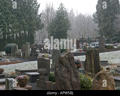 graveyard with grave stones by frosty weather in winter in Ortenberg Hesse Germany Stock Photo
