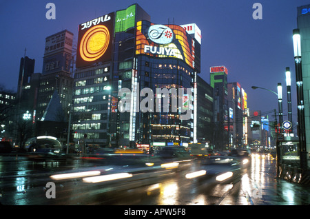 Japan,Japanese,Asia,Asian Far East,Eastern,Japanese,Nippon,Orient,Tokyo,Ginza District,traffic,transportation,vehicles,office buildings,city skyline,c Stock Photo