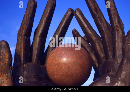 Metal hands around a granite world, Statue Park, Budapest, Hungary, Europe Stock Photo