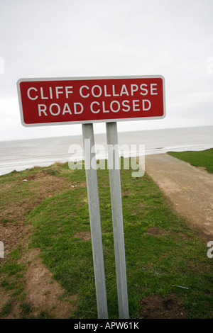 Sign Warning of Cliff Road Closure due to Cliff Collapse at Atwick between Hornsea and Bridlington, Yorkshire, England Stock Photo