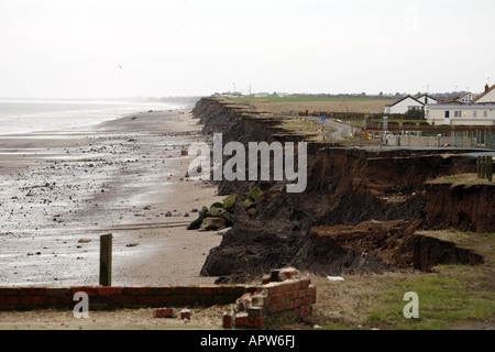 Severe Coastal Erosion Threatening propertoes on the North Sea Coast between Hornsea and Bridlington Stock Photo