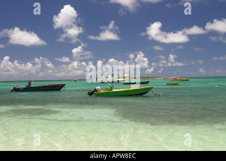 Fishing boats floating off the beach in Island Harbour off the island of Anguilla in the Caribbean West Indies Stock Photo