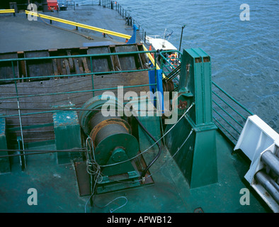 Power winch and steel cables being used to raise a ramp on a car ferry. Stock Photo