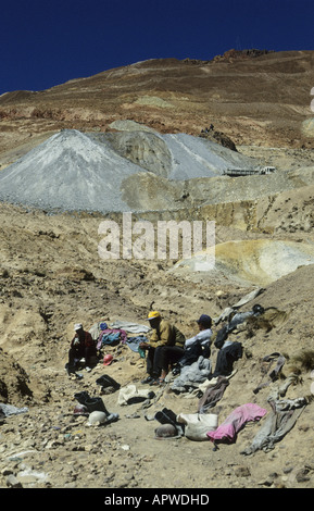 Miners chewing coca leaves and socialising before they start working in the mines on Cerro Rico. Potosi, Bolivia Stock Photo