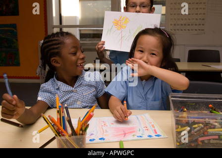 Kids having fun in art class at After School Club Archbishop Sumner Primary School Kennington London Stock Photo