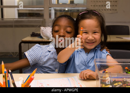 Kids having fun in art class at After School Club, Archbishop Sumner Primary School, Kennington, London, UK. Stock Photo