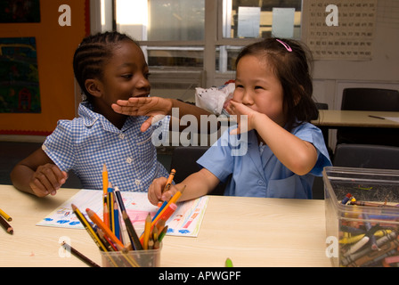 Kids having fun in art class at After School Club Archbishop Sumner Primary School, Kennington, London, UK. Stock Photo