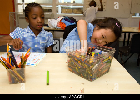 Kids having fun in art class at After School Club Archbishop Sumner Primary School Kennington London Stock Photo