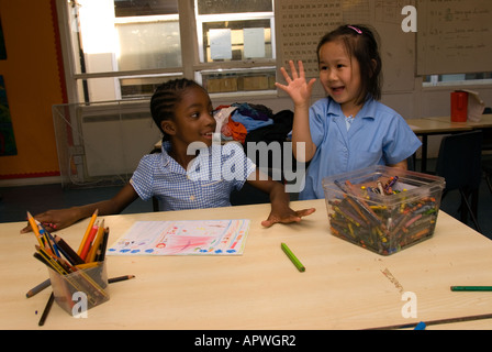 Kids having fun in art class at After School Club Archbishop Sumner Primary School, Kennington, London UK Stock Photo