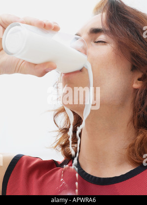 Man drinking a glass of milk Stock Photo