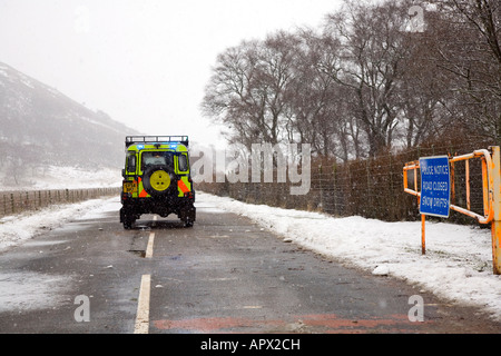 Snow gates & access road closed sign on the A93 Braemar, Glenshee, Blairgowrie road after winter blizzard, Cairngorms National Park, Scotland uk Stock Photo