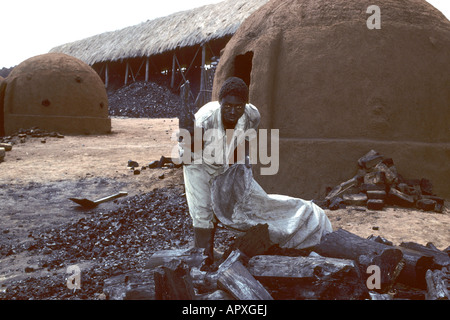 Workers at a charcoal factory. Stock Photo