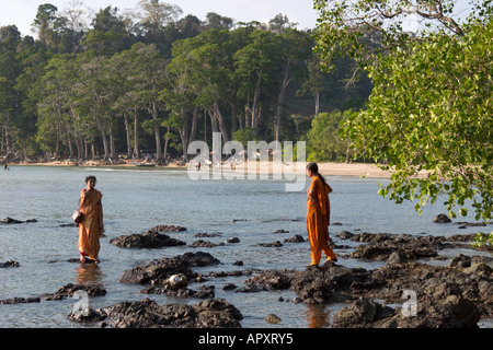 Two Indian women bathing in the water, Chiriya Tapu beach, South Andaman, Andaman Islands, India Stock Photo