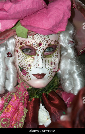 Carnival in Venice - Woman with white curls and white mask decorated with flowers Carnival in Venice - Woman with white curls and white mask decorated with flowers