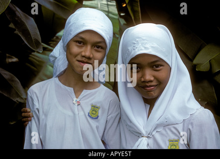 2, two, Malaysian girls, girls, Malay girls, children, students, eye contact, front view, madrasa school, Islamic school, Kuala Lumpur, Malaysia, Asia Stock Photo