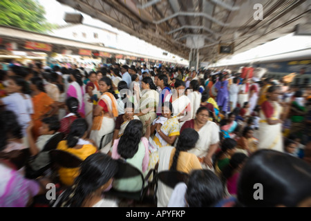 INDIA KERALA TRIVANDRUM CROWDS OF PEOPLE AT TRAIN STATION Stock Photo