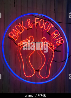 Neon sign in front of a shop Stock Photo
