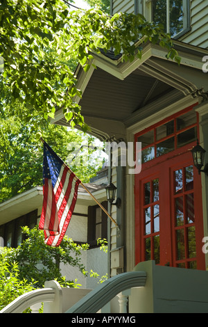 ILLINOIS Oak Park American flag hanging by red door of home historic district on Forest Avenue Stock Photo