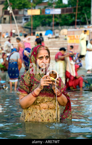 Ritual morning bath. Assi Ghat. Ganges river. Varanasi. India Stock Photo