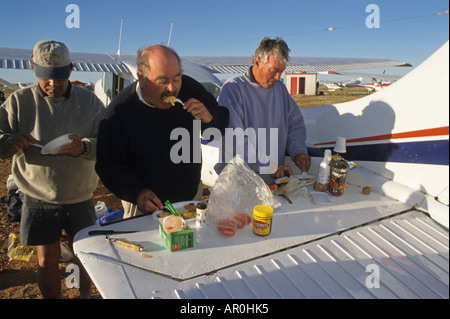 Breakfast at Birdsville horse race, Queensland, Birdsville, light aircraft fly in for the annual outback horse race, and the air Stock Photo