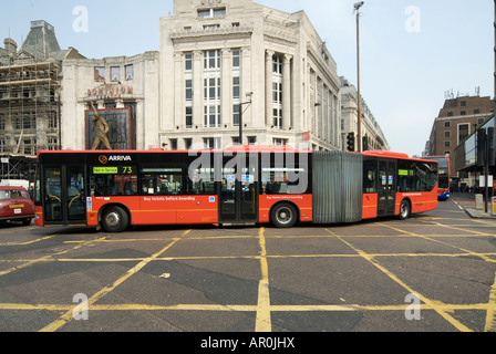 Bendy bus turning a corner in London Stock Photo