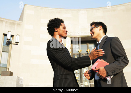 Two men greeting each other Stock Photo