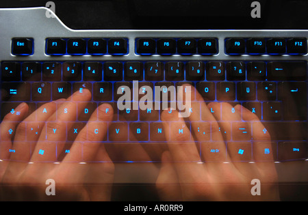 Hands writing on a Keyboard Stock Photo
