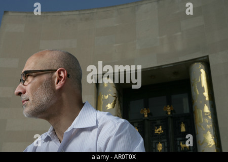 mature man with glasses looking away Stock Photo