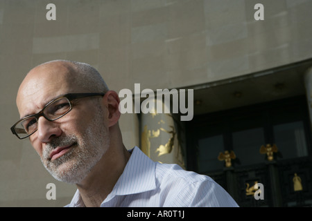 mature man with glasses looking away Stock Photo
