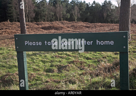 Please Take Your Litter Home sign in Rendlesham forest, Suffolk, England Stock Photo