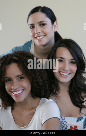 Three young women, smiling at camera Stock Photo