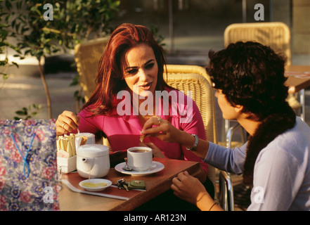 Two women having conversation as they have a cup of tea. Stock Photo