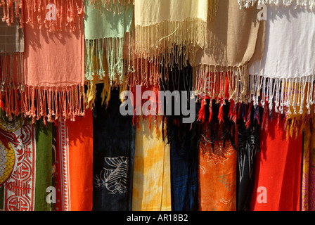 Scarves and sarongs for sale at Anjunas weekly market Goa India Stock Photo