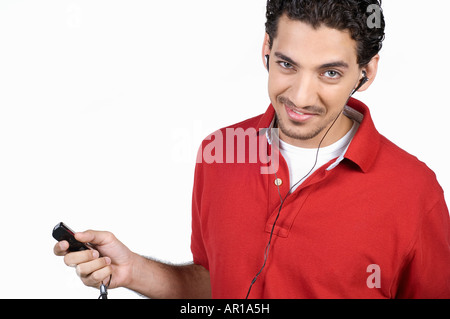 Young man listening to music Stock Photo