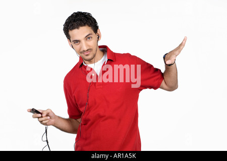 Young man listening to music Stock Photo