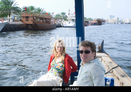 Couple on Abra at Dubai Creek, United Arab Emirates Stock Photo