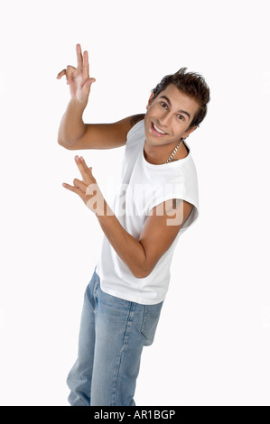 Young man gesturing, smiling, portrait Stock Photo