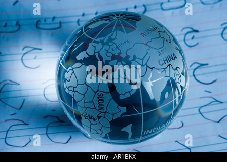Globe over paper, close-up Stock Photo