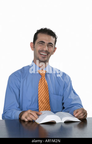 Businessman with book Stock Photo