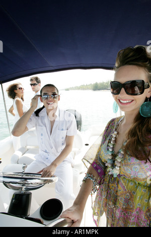 Friends relaxing on boat. Stock Photo