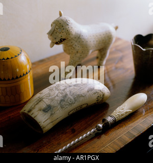 ivory and wood objects on top of a chest in an English country house Stock Photo