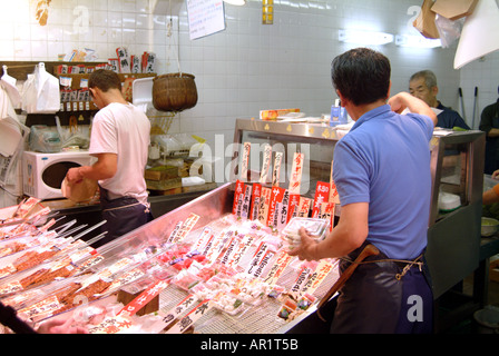 Nishiki street market fishmonger stall Kyoto Japan Stock Photo