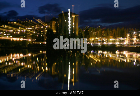 LIGHTS; Night photo of a large hotel and its reflection in a nearby resort lake.  Chateau Lake Louise, Banff National   Park Stock Photo