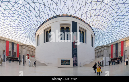 Horizontal elevated wide angle (4 picture stitch panoramic) of the Great Court and Reading room at the British Museum in the sun Stock Photo
