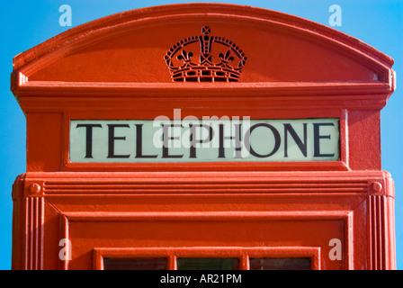 Horizontal close up of the fascia section of K2 model red telephone box on a bright sunny day Stock Photo