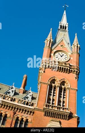 Vertical close up of the impressive clock tower of the newly restored St Pancras Station on a bright sunny day Stock Photo