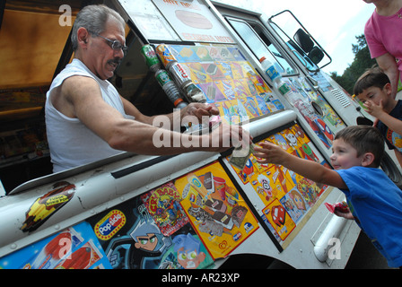 Photo of an Ice Cream man service Ice Cream from a Truck Stock Photo